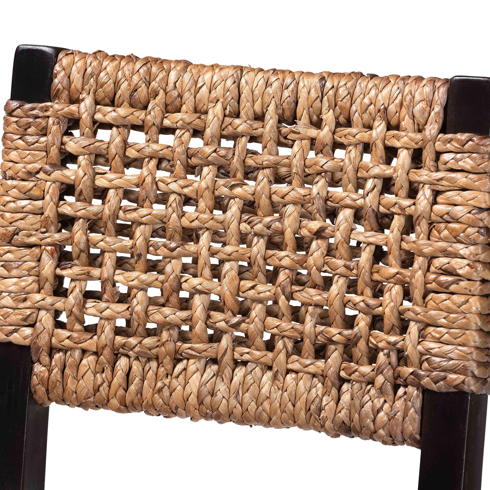 Close-up of the woven seagrass seat and back of a bar stool.