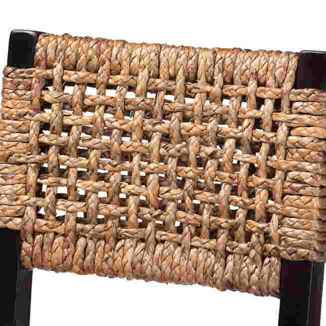 Close-up of the woven seagrass seat and back of a bar stool.