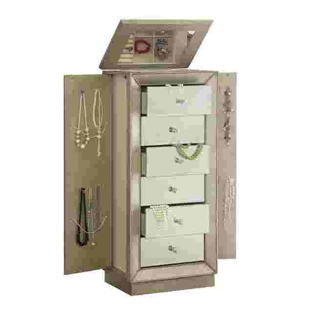 Gold-toned jewelry armoire door open showing interior drawers